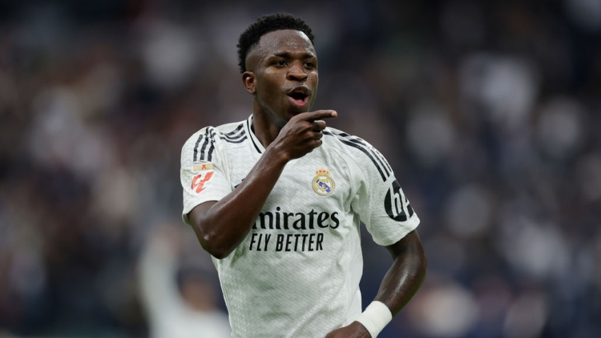 Two Vinicius penalties help Real Madrid go top in La Liga