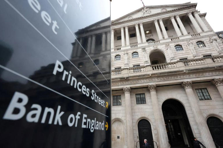 Bank of England cuts rates, sees higher inflation and weaker growth